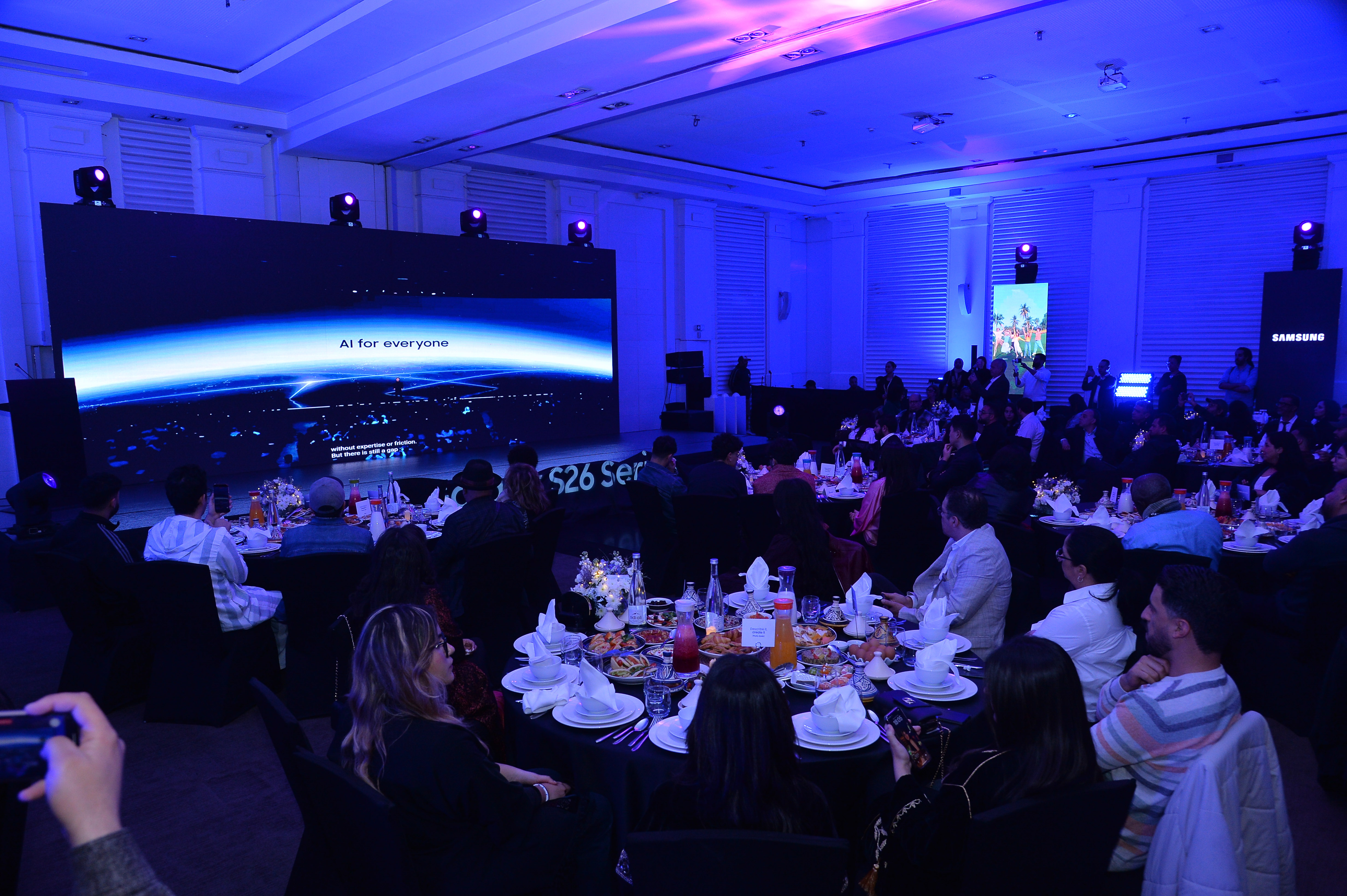 Journalists and guests attending a large media presentation