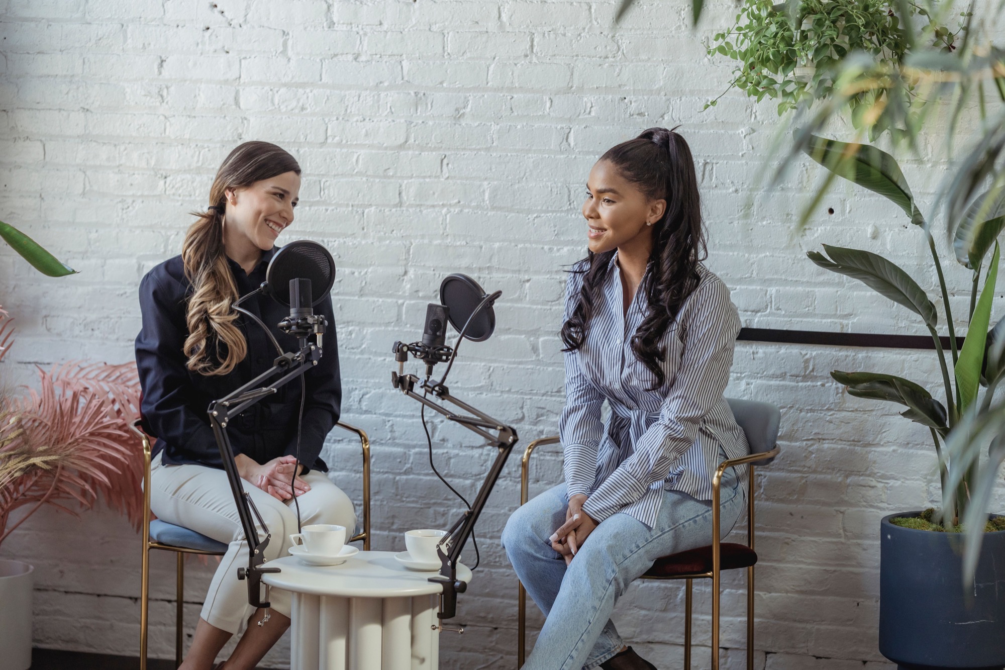 Two communications professionals recording a podcast interview